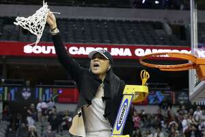 South Carolina coach Dawn Staley cuts down the net as she and the team celebrate their win over Mississippi State in the final of NCAA women's Final Four college basketball tournament, Sunday, April 2, 2017, in Dallas. South Carolina won 67-55. (AP Photo/LM Otero)