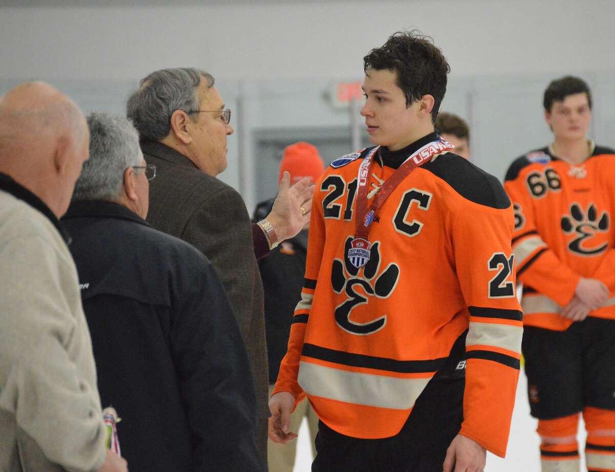 Edwardsville senior Carson Lewis receives his bronze medal after Sunday night's game.