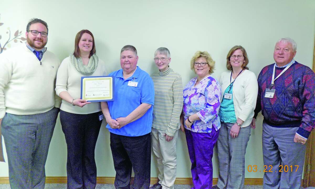   Shown are Jason Vice, regional director presenter of award, Senior Life Solution staff: Tennille Gibson, program director, Mary Jean Michalski, patient coordinator, Kimberly Arndt, clinical therapist, Kathy Booms, LPN nurse, Jill Wehner, hospital V.P./COO and Paul Clabuesch, hospital CEO/President. (Submitted photo)