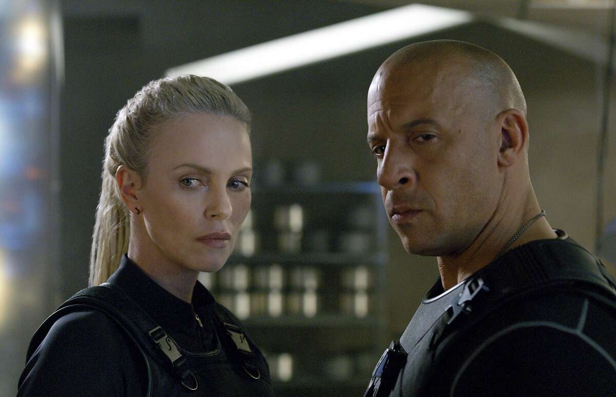 This image released by Universal Studios shows Charlize Theron, left, and Vin Diesel in a scene from "The Fate of the Furious," expected in theaters on April 14. (Universal Studios via AP)