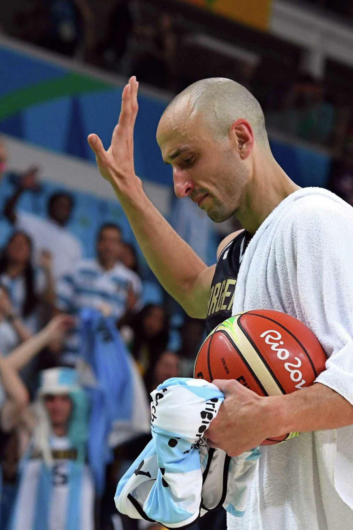 Manu Ginobili waves to fans after Argentina was eliminated from the Rio Olympics tournament.