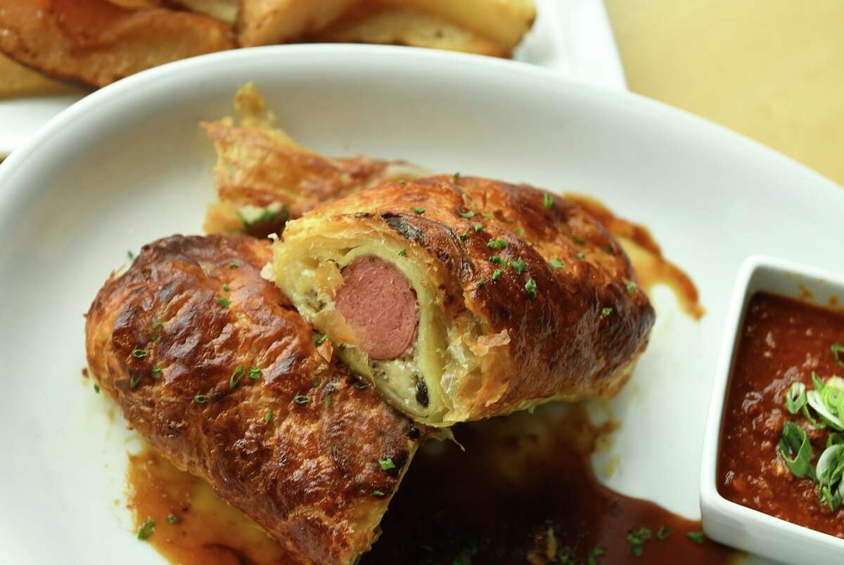 B&B Butchers & Restaurant is marking the Houston Astros' opening week, April 3-9, with a lineup of specialty hot dogs including the Wellie Dog (Texas wagyu hot dog baked in a puff pastry with wild mushroom duxelle and seared foie gras over a marsala sauce).