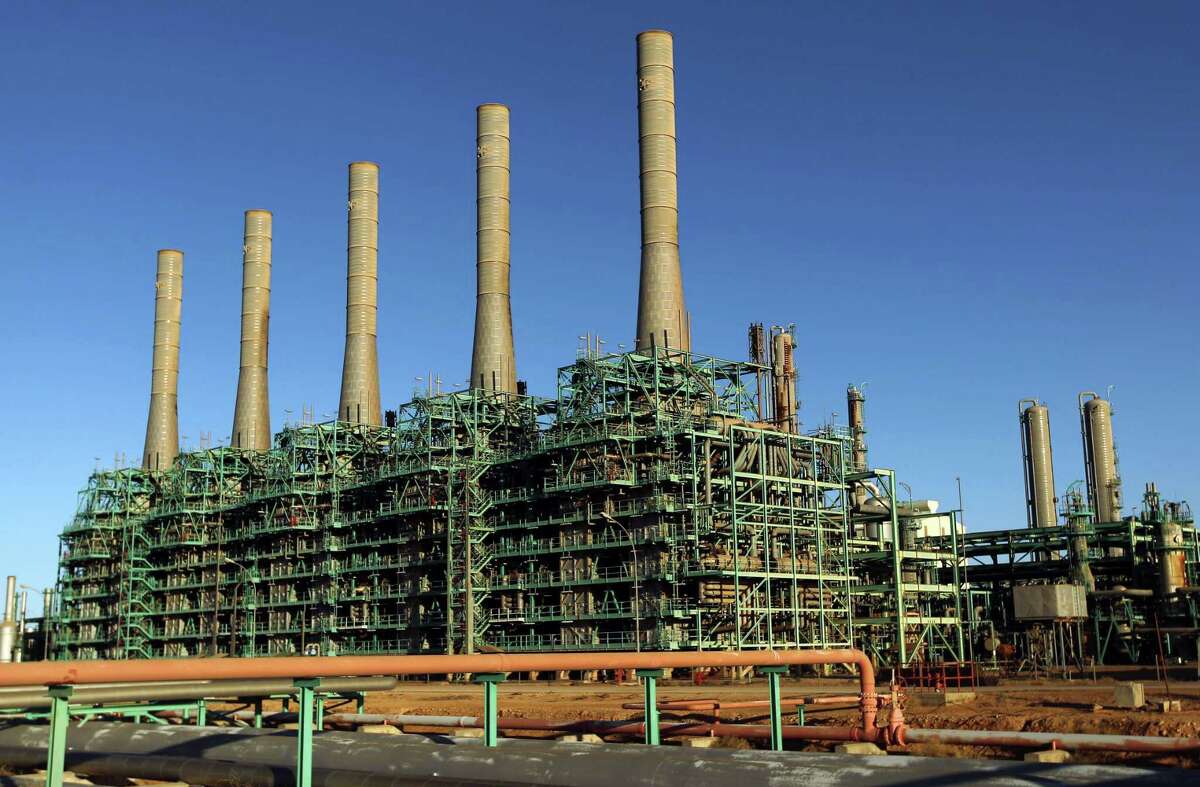 Libya’s output rose to about 660,000 barrels a day, a person familiar with the matter who asked not to be identified said. Libya has sought to boost crude exports after fighting among rival militias hobbled oil production following the overthrow in 2011 of Moammar Al Qaddafi. Shown is an oil refinery in Libya’s northern town of Ras Lanuf.