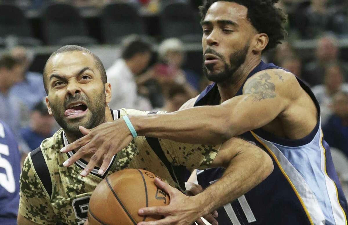 Tony Parker fights Mike Conley to get to the lane as the Spurs host the Grizzlies at the AT&T Center on March 23, 2017.
