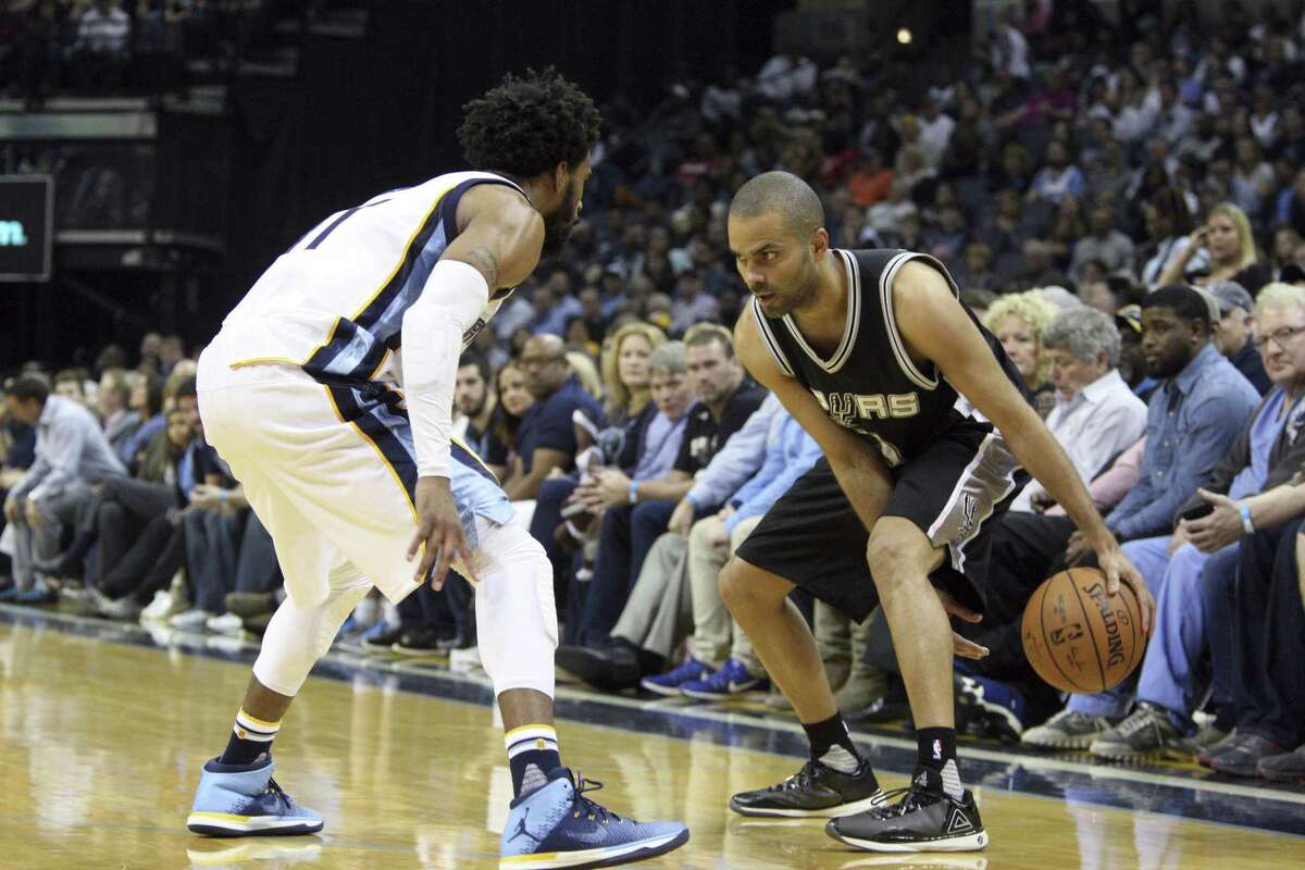 Grizzlies’ Mike Conley (left) defends the Spurs’ Tony Parker during the second half on March 18, 2017, in Memphis, Tenn.