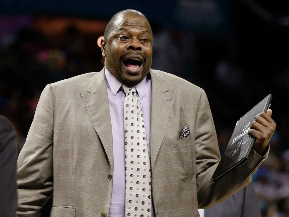 FILE - In this April 13, 2015, file photo, Charlotte Hornets assistant coach Patrick Ewing argues a call during the second half of an NBA basketball game against the Houston Rockets in Charlotte, N.C. Summer league is a chance for players to get noticed and maybe have a shot at making it in the NBA. Same goes for coaches. That's why NBA assistants like Juwan Howard and Patrick Ewing embraced the chance to run rosters this summer. (AP Photo/Chuck Burton, File)