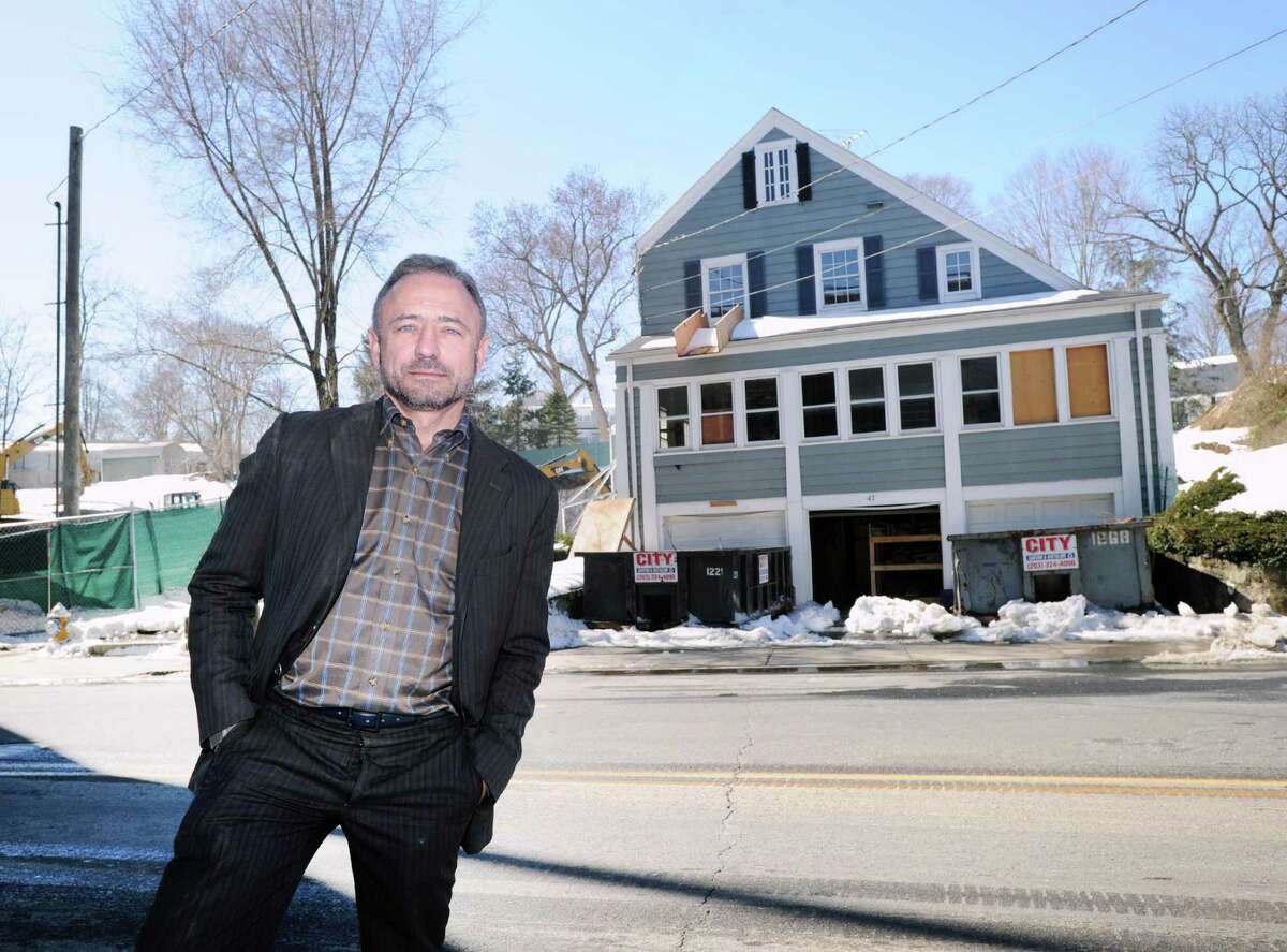 David Scott Parker, the architect who is in charge of renovating and redesigning the historic buidling that will be the new headquarters for the Greenwich Historical Society, stands across the street from the building that is located at the Greenwich Historical Society in the Cos Cob section of Greenwich, Conn., Friday, March 17, 2017. The buidling was once a tavern and a hotel.