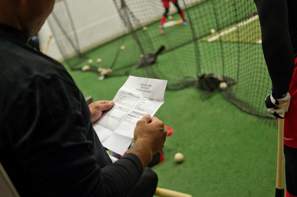 Coach Fumi Ishibashi looks over the batting practice grouping during practice on Monday at Dow Diamond. The Loons held their first practice in Midland inside due to the rainy weather. The Loons face the Lansing Lugnuts in their season opener scheduled for Thursday, April 6, in Midland.