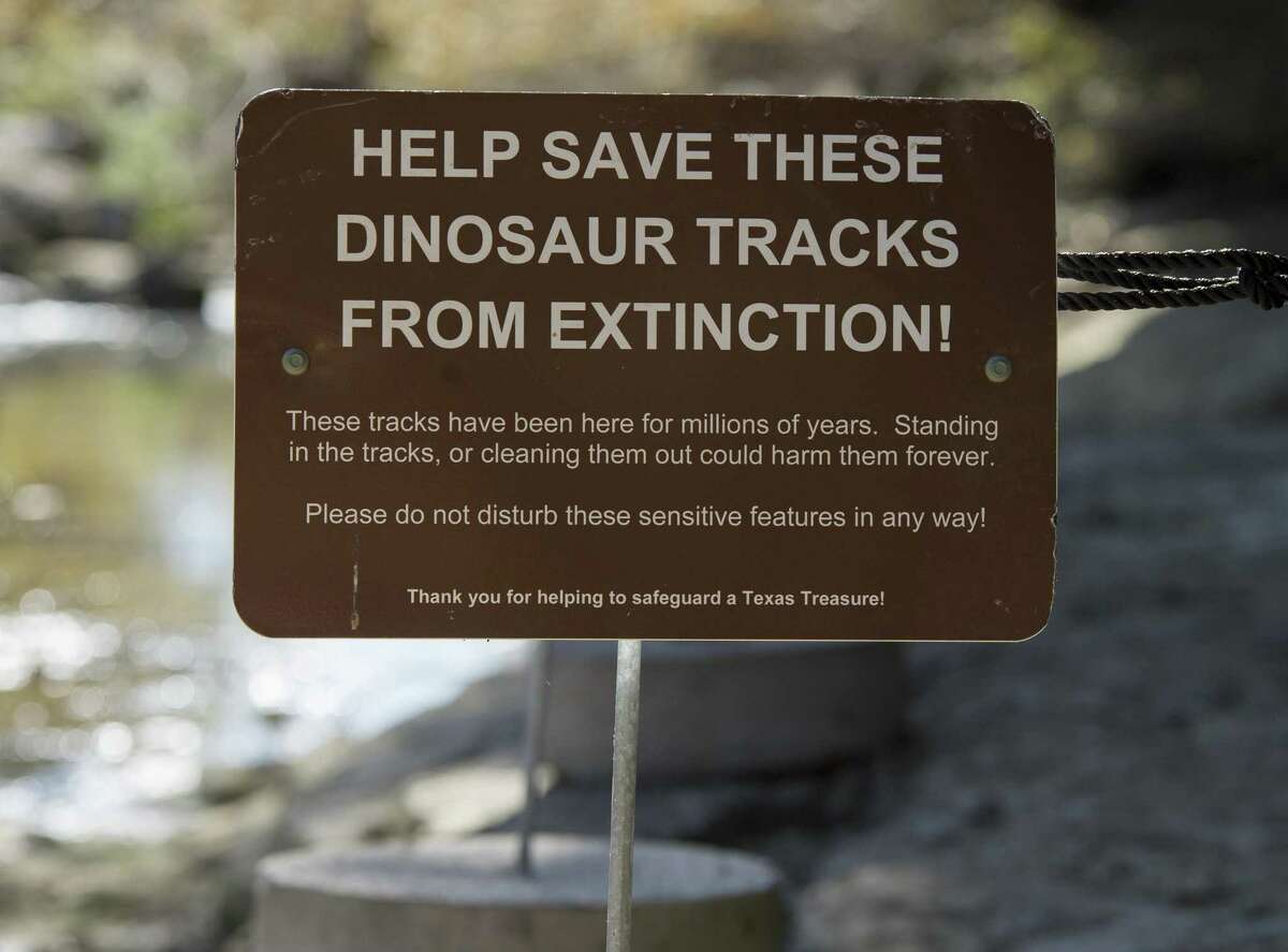 A sign marks a boundary of an area where fossilized dinosaur tracks can be seen at Government Canyon State Natural Area in San Antonio.