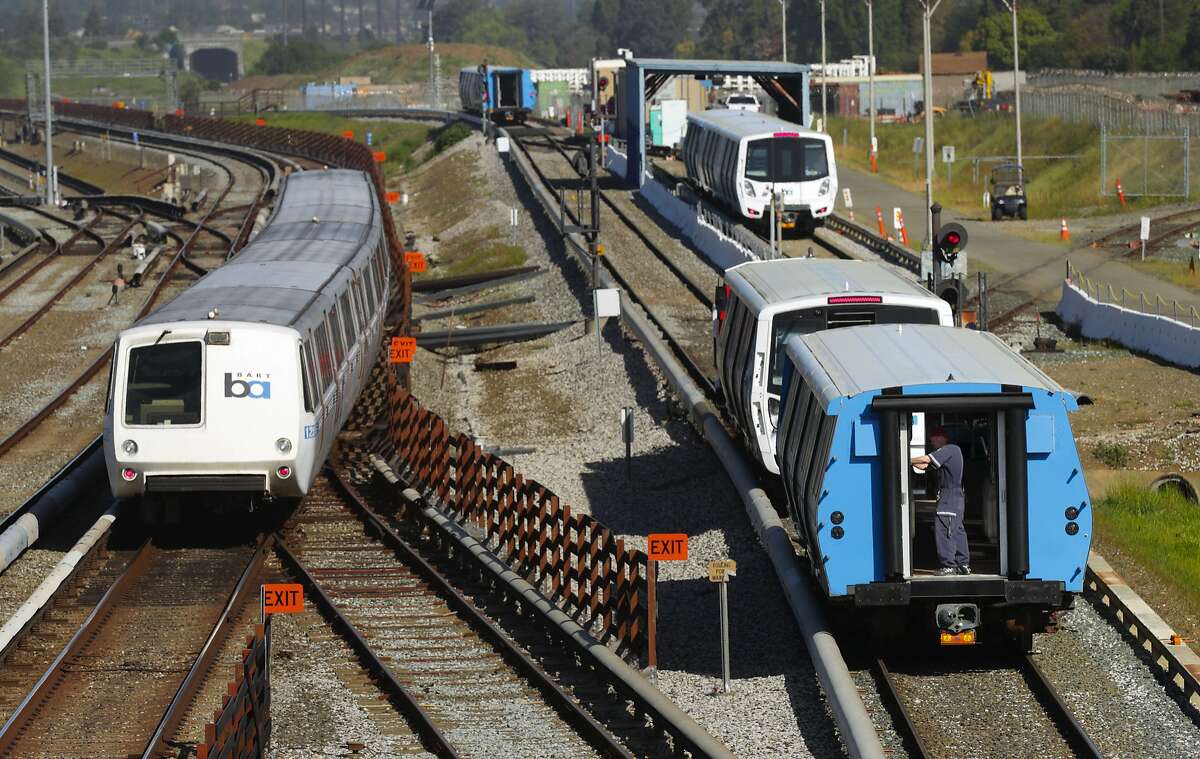 Workers begin testing of the new BART cars, (right) along the test track at the BART maintenance complex, in Hayward, Ca. on Mon. April 3 2017.
