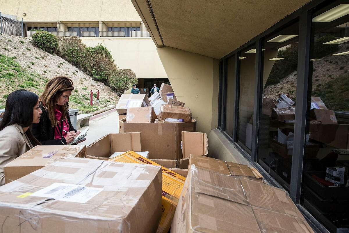 Stacked shipments of H-1B visa petitions outside a government processing center in Laguna Niguel, Calif., April 3, 2017. Possible changes to the program that allows technology companies to import foreign workers may be adding to an even heavier rush than usual this year. (Eros Hoagland/The New York Times)