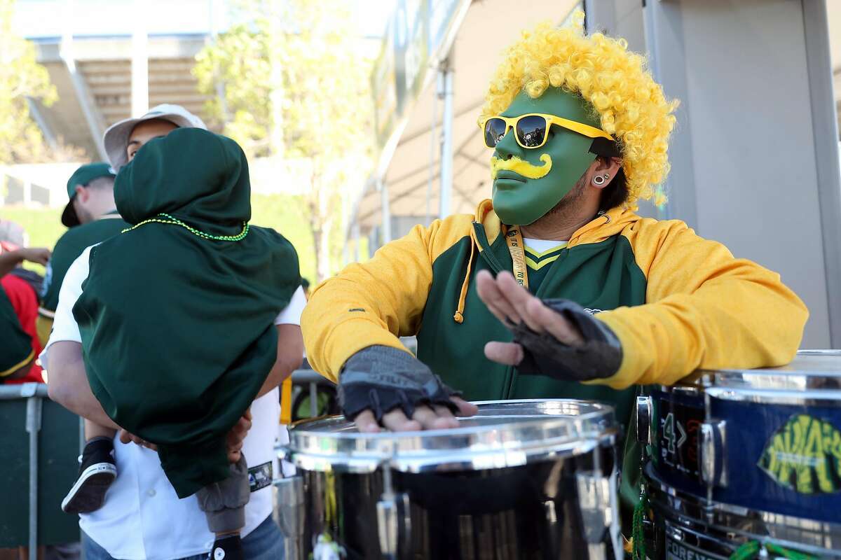 First in line to enter the ballpark, Oakland Athletics' fan Sam Molina of Hayward plays his drums before home opener at the Oakland Coliseum in Oakland, Calif., on Monday, April 3, 2017.