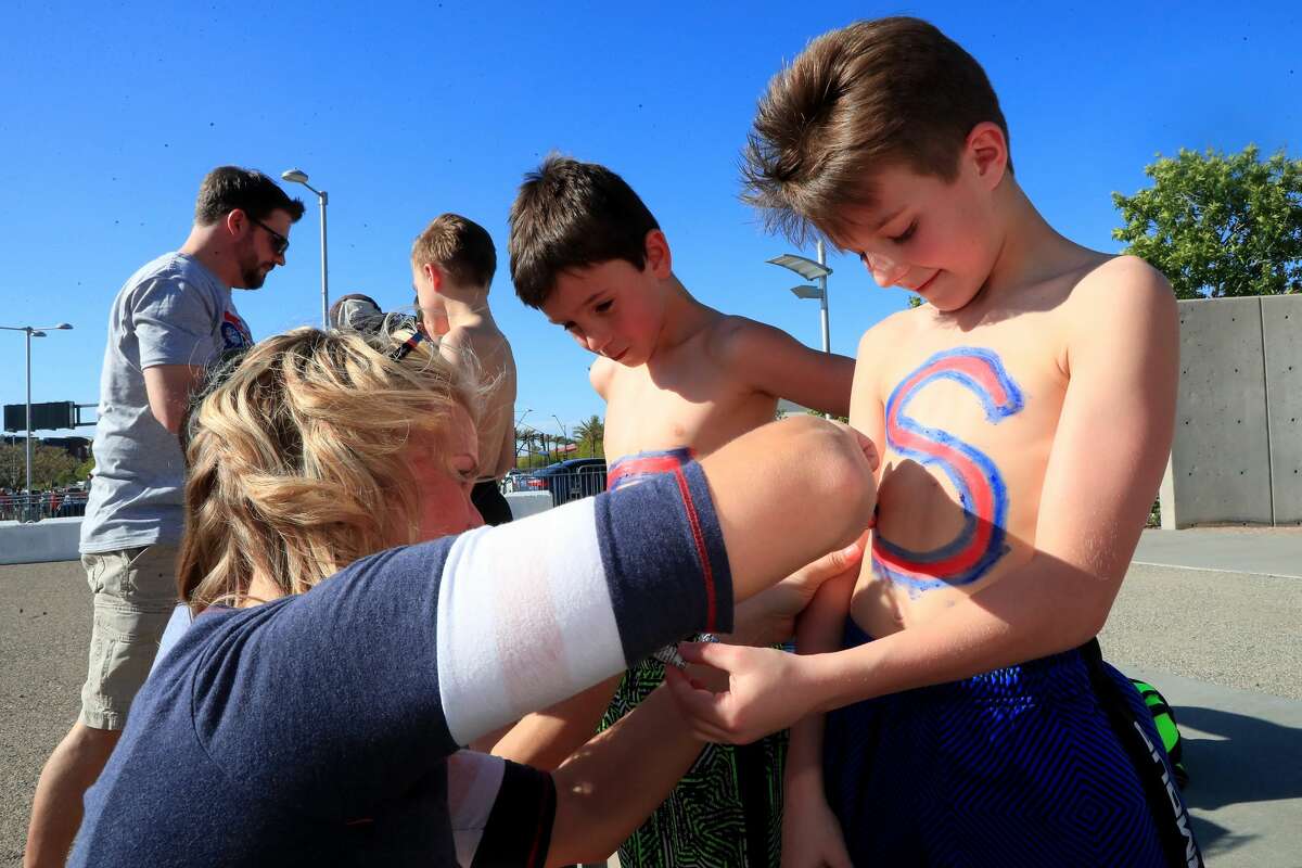 Gonzaga Bulldogs fans Winston Schroeder and Nathan Zettle have their chests painted before the game against the North Carolina Tar Heels during the 2017 NCAA Men's Final Four National Championship game at University of Phoenix Stadium on April 3, 2017 in Glendale, Arizona. (Photo by Christian Petersen/Getty Images)