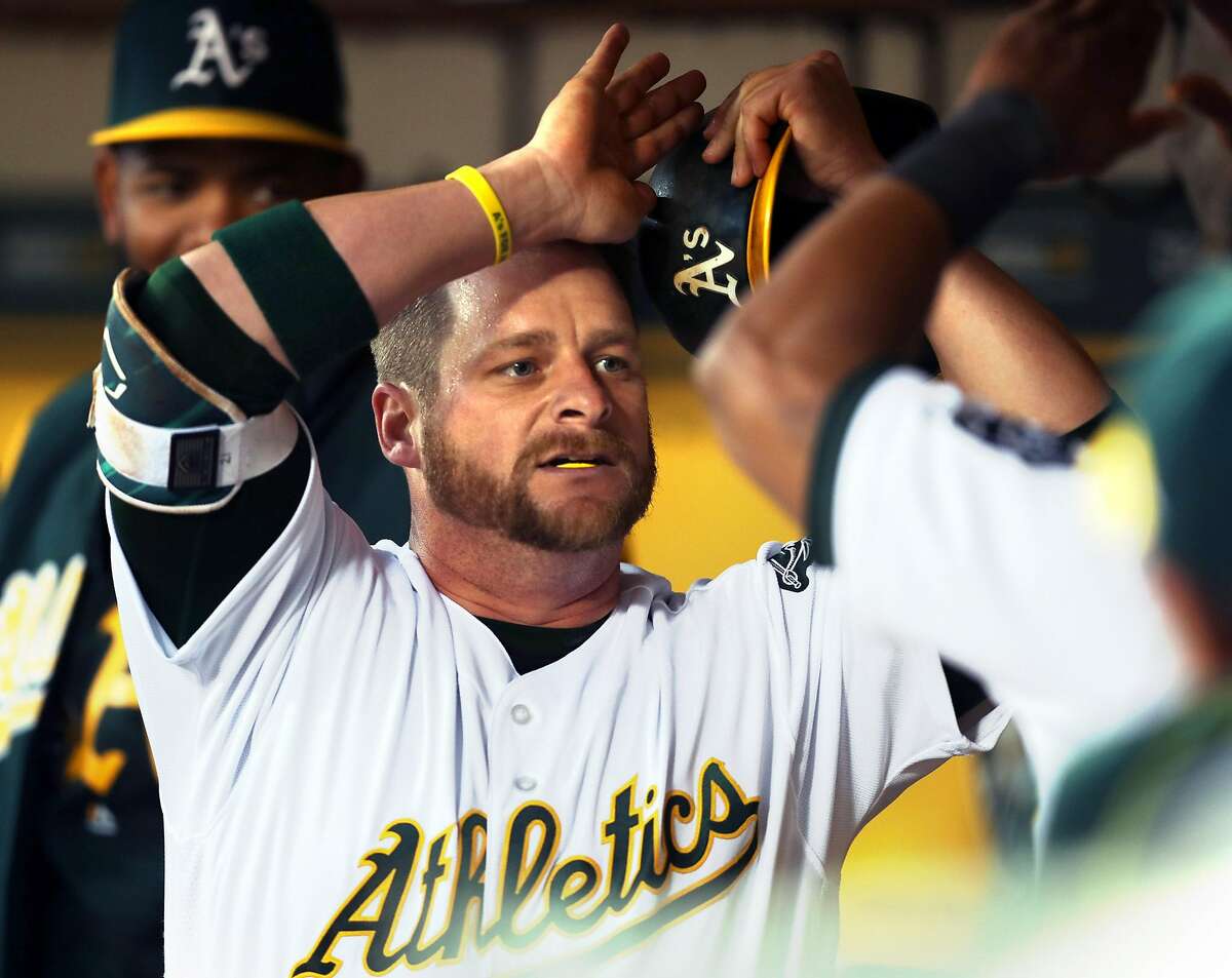 Oakland Athletics' Stephen Vogt celebrates his solo home run in 2nd inning against Anaheim Angels during A's home opener at the Oakland Coliseum in Oakland, Calif., on Monday, April 3, 2017.