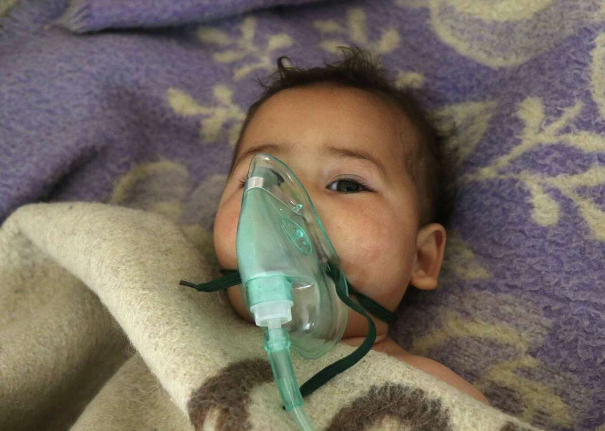 A Syrian child receives treatment at a small hospital in the town of Maaret al-Noman following a suspected toxic gas attack in Khan Sheikhun, a nearby rebel-held town in Syrias northwestern Idlib province, on April 4, 2017. Warplanes carried out a suspected toxic gas attack that killed at least 35 people including several children, a monitoring group said. The Syrian Observatory for Human Rights said those killed in the town of Khan Sheikhun, in Idlib province, had died from the effects of the gas, adding that dozens more suffered respiratory problems and other symptoms. / AFP PHOTO / Mohamed al-Bakour / ADDING INFORMATION IN CAPTIONMOHAMED AL-BAKOUR/AFP/Getty Images
