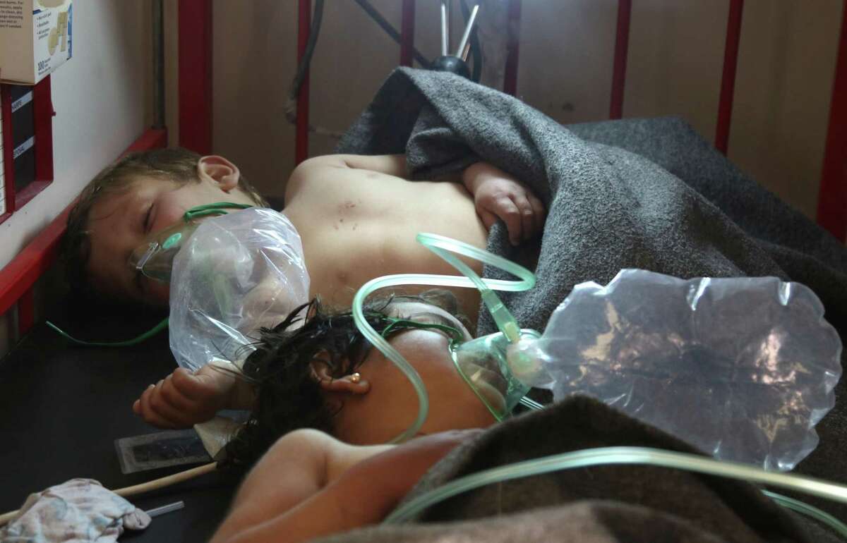 Syrian children receive treatment at a small hospital in the town of Maaret al-Noman following a suspected toxic gas attack in Khan Sheikhun, a nearby rebel-held town in Syrias northwestern Idlib province, on April 4, 2017. Warplanes carried out a suspected toxic gas attack that killed at least 35 people including several children, a monitoring group said. The Syrian Observatory for Human Rights said those killed in the town of Khan Sheikhun, in Idlib province, had died from the effects of the gas, adding that dozens more suffered respiratory problems and other symptoms. / AFP PHOTO / Mohamed al-Bakour / ADDING INFORMATION IN CAPTIONMOHAMED AL-BAKOUR/AFP/Getty Images