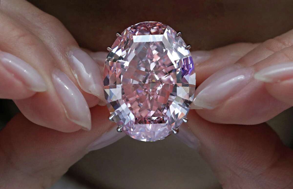 A stunning 59.6-carat diamond known as the “Pink Star” sold for $71.2 million at a Sotheby’s auction Tuesday in Hong Kong, setting a new world record for any diamond or jewel, according to the auction house.