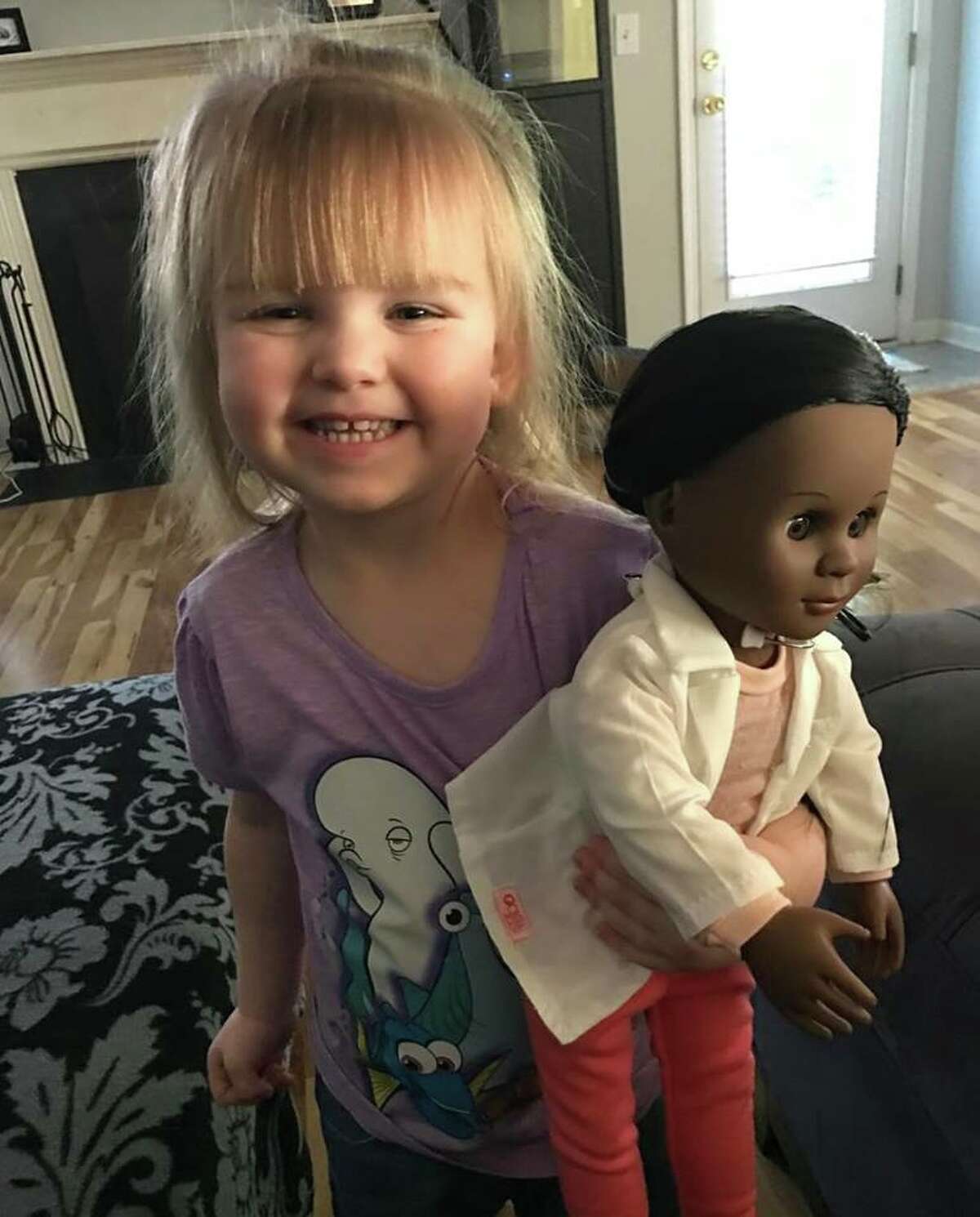 A Young Girl Picks Her Doll Based On Profession Not Skin Color 4526