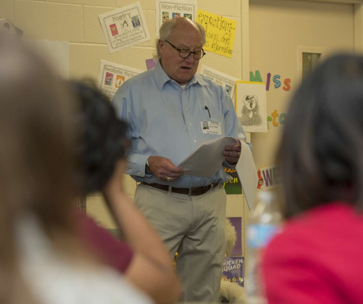 Author Mark Parker reads a short story 04-04-17 he wrote to a class at Rusk Elementary. The anthology will be printed in a upcoming book, West Texas Lore and Legends. Tim Fischer/Reporter-Telegram