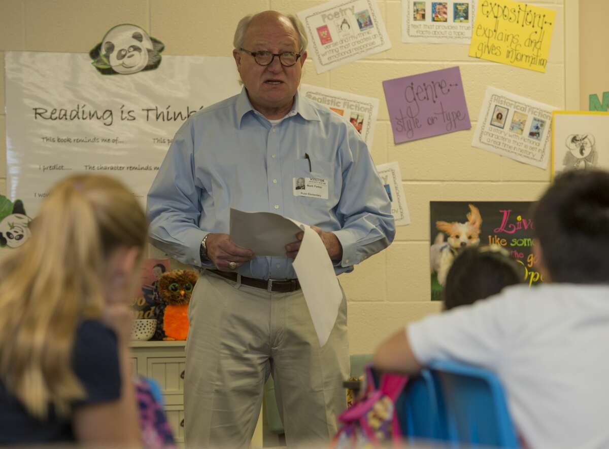 Author Mark Parker reads a short story 04-04-17 he wrote to a class at Rusk Elementary. The anthology will be printed in a upcoming book, West Texas Lore and Legends. Tim Fischer/Reporter-Telegram