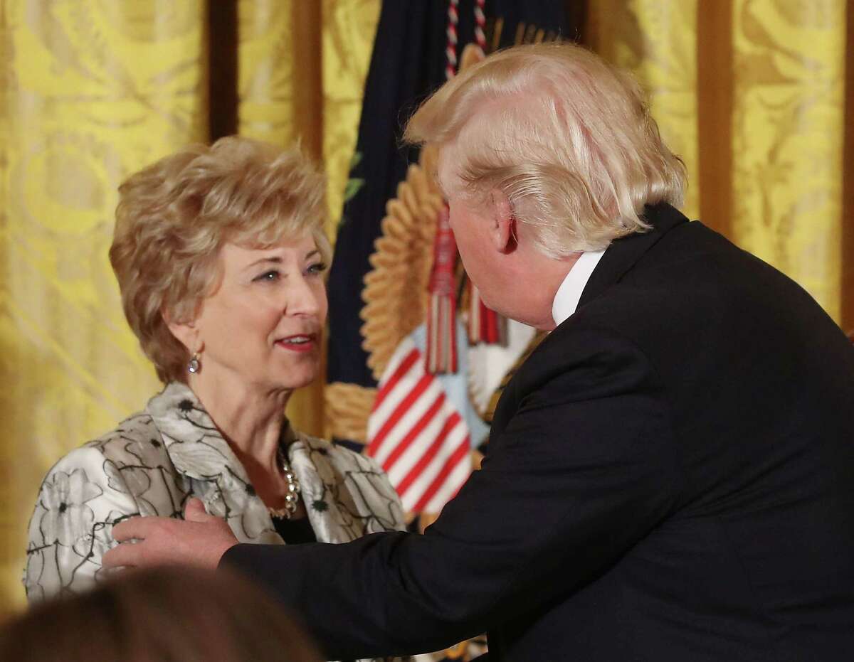 U.S. President Donald Trump greets Small Business Administration head Linda McMahon during an event celebrating Women's History Month, in the East Room at the White House March 29, 2017 in Washington, DC.