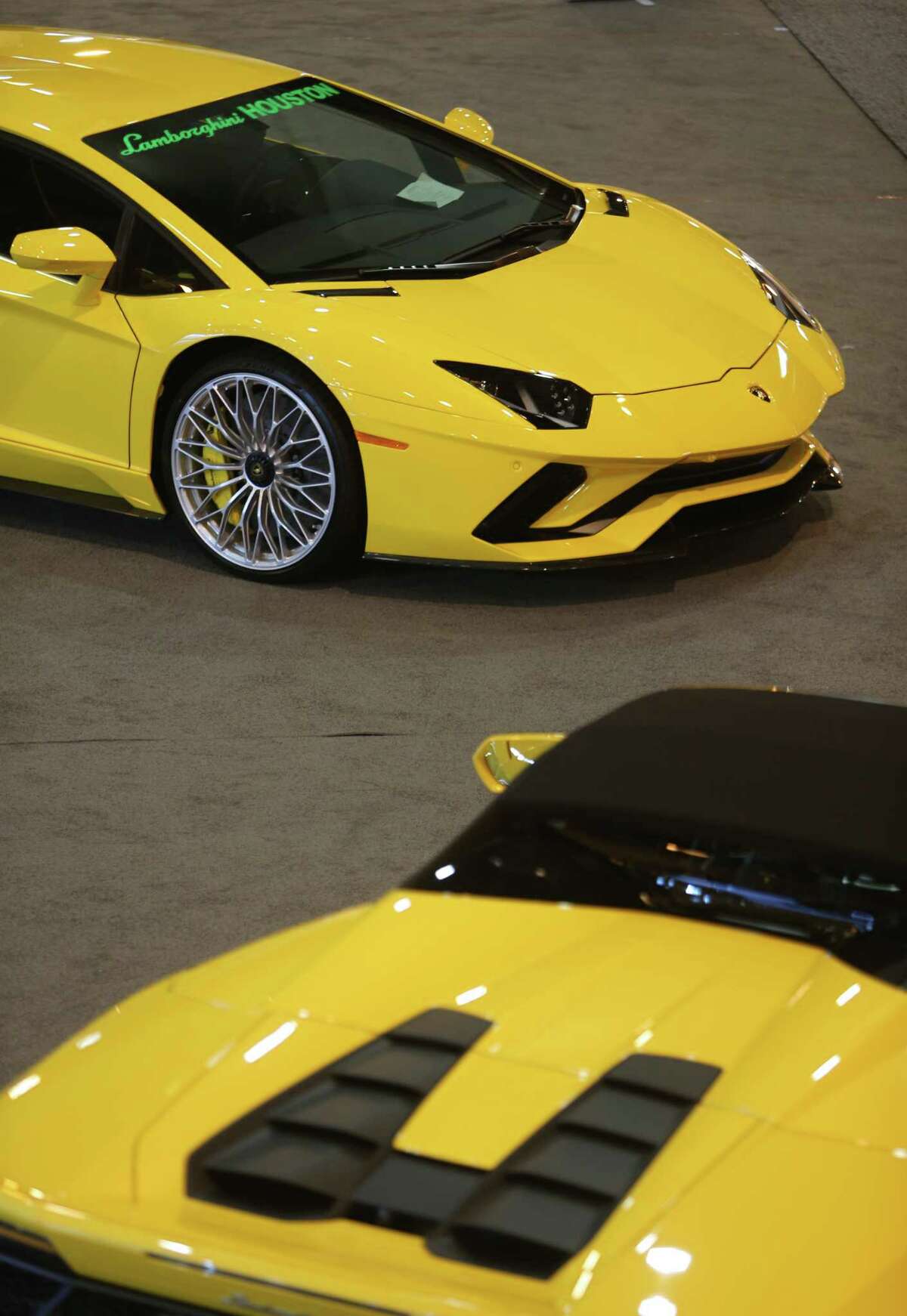Two Lamborghinis are in place during the final day of setup for the Houston Auto Show at NRG Center, Tuesday, April 4, 2017, in Houston. (Mark Mulligan / Houston Chronicle)