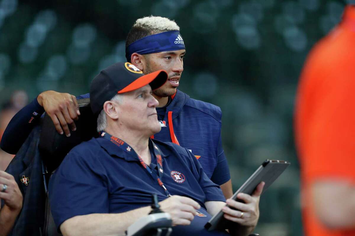 Houston Astros shortstop Carlos Correa (1) talks with Raul Pedraza, one of the Astros minority owners during batting practice before the start of an MLB baseball game at Minute Maid Park, Tuesday, April 4, 2017, in Houston.