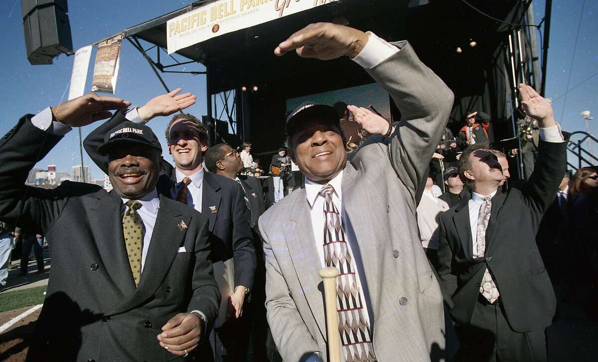 Groundbreaking at Pac Bell Park, the new Giants ballpark in China Basin, on Dec. 11, 1997. Willie Brown, Larry Baer and Willie Mays shade their eyes from the sun.
