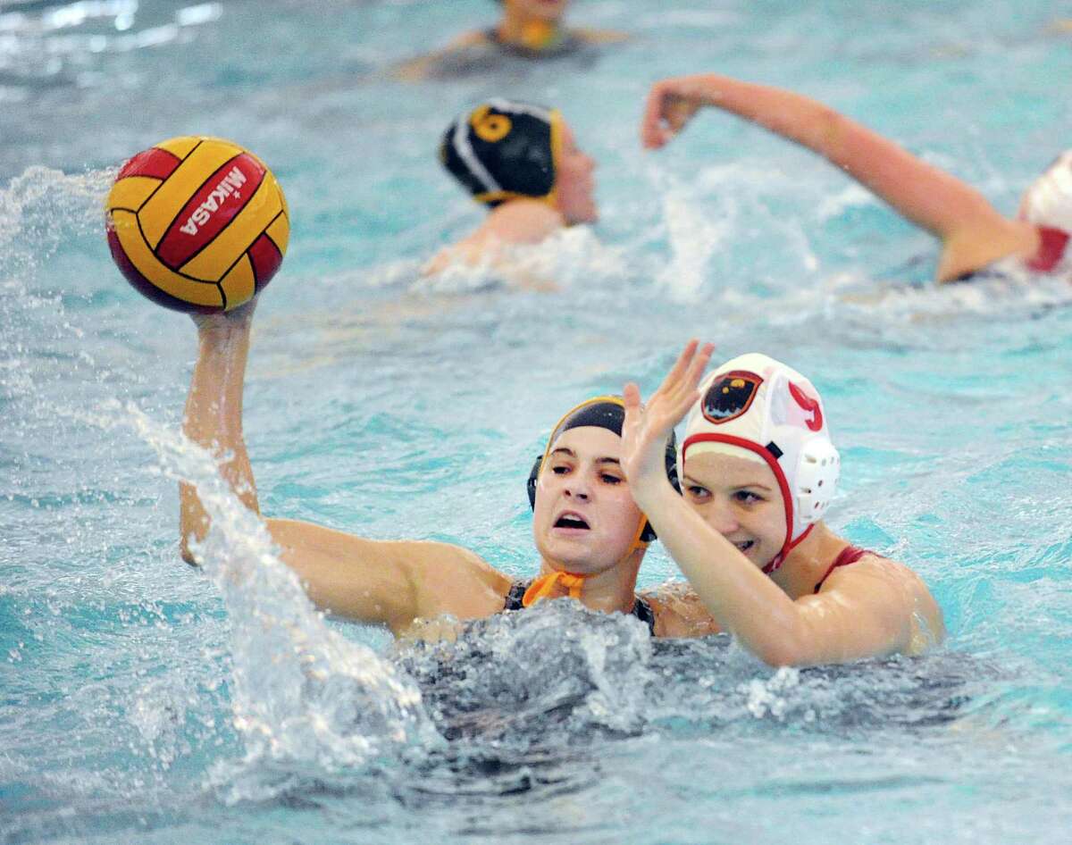 Borden Wahl, left, of Greenwich Academy, protects the ball from Kaila Carroll of Greenwich High School during the girls high school water polo match between Greenwich Academy and Greenwich High School at the YMCA of Greenwich, Conn., Tuesday, April 4, 2017. GA won the match beating GHS, 13-12.