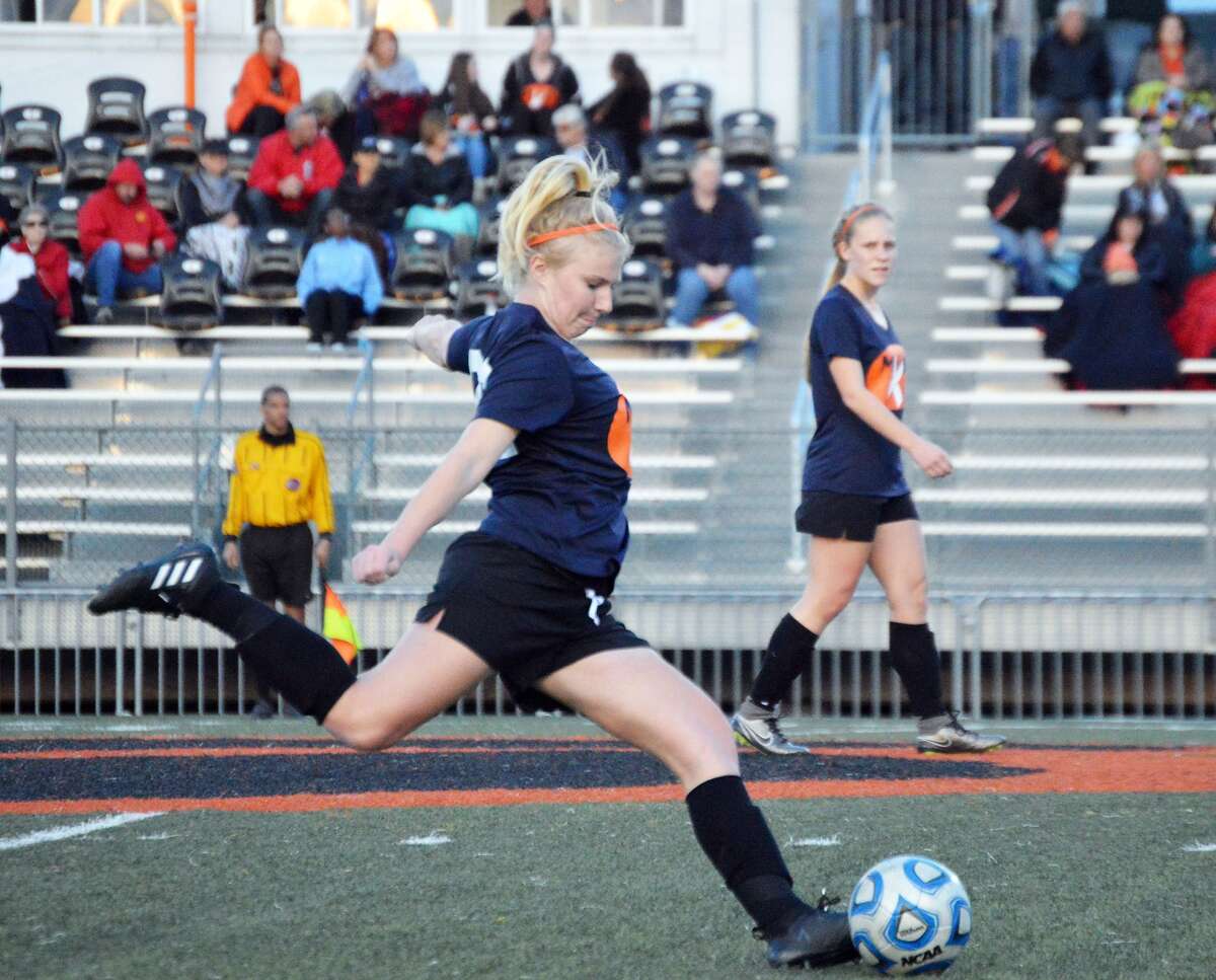 Edwardsville senior defender Taylor Hansen takes a free kick near midfield in first-half action against Belleville East at the District 7 Sports Complex.