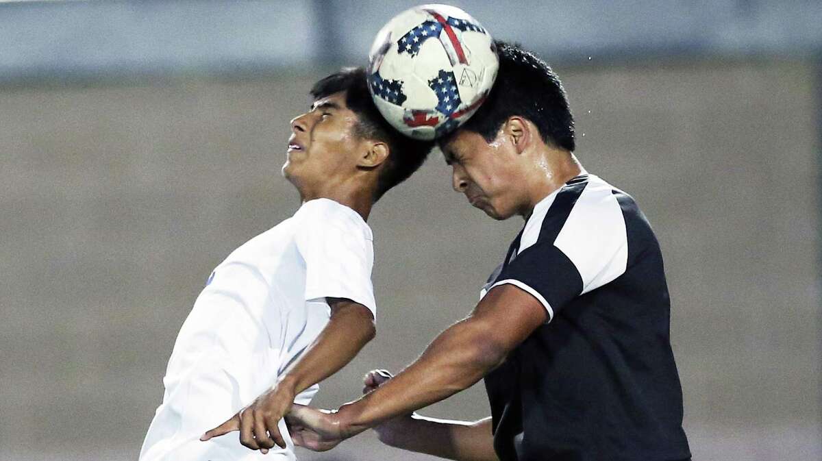 Jay’s Israel Hernandez (left) and Clark’s Alec Asencio contend for control of the ball in a Class 6A third-round boys soccer playoff match at Farris Stadium on April 4, 2017.