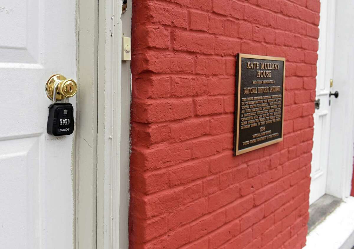 A National Historic Landmark plaque is seen on the Kate Mullany National Historic Site, at right, at 350 8th St. on Tuesday, April 4, 2017 in Troy, N.Y. The operators of the site in Troy were shocked to discover that the duplex that adjoins the one-time home of the labor leader was up for auction on Monday. The bank pulled the duplex from auction and the organizers of the center that oversees the home are trying to find a way to keep the duplex from being auctioned. (Lori Van Buren / Times Union)