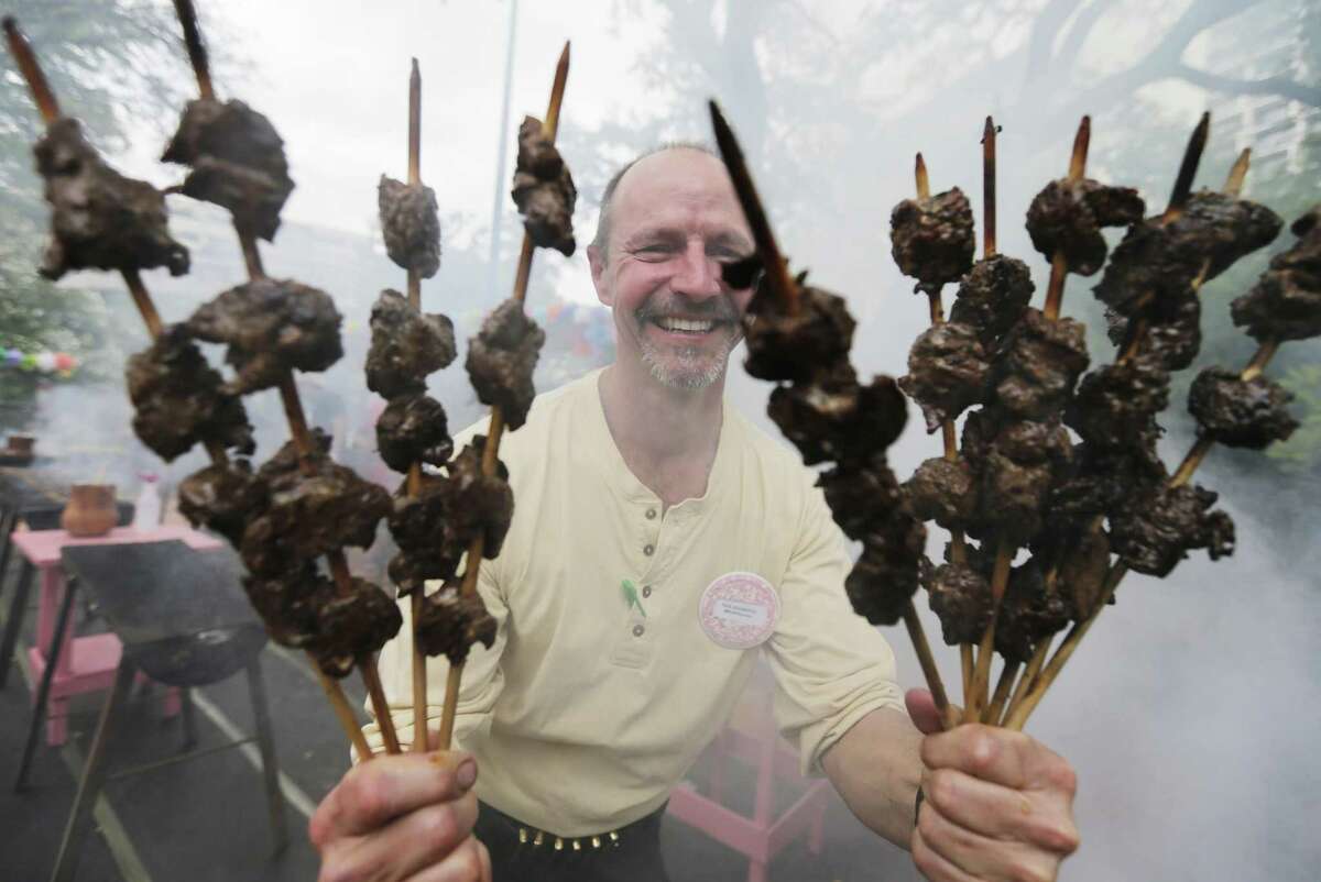 Fiesta foods are another tradition many enjoy. Here, Paul Rockwood holds skewers of anticuchos during the 2015 A Night In Old San Antonio. But given the option of sitting down and enjoying a nice meal off a plate or eating food on a stick and Deborah Wedge, said she’ll choose the former any day of the week.