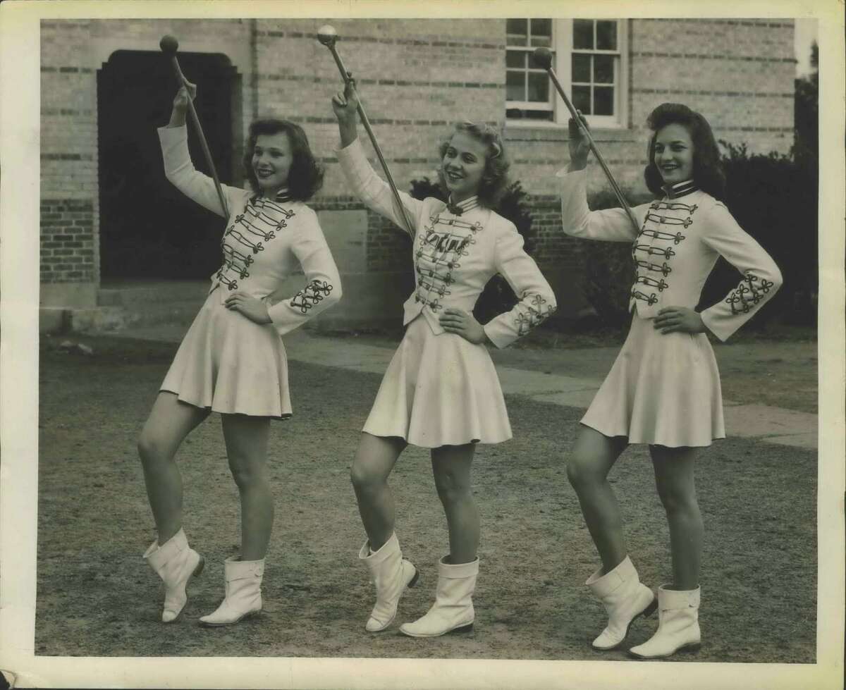 Three attractive drum majorettes who will participate in the band festival and the Battle of Flowers Parade are, left to right, Mary Helen Jeffrey, Minifred Teitschik, and Velma Wright, who are part of the Floresville High School Band.
