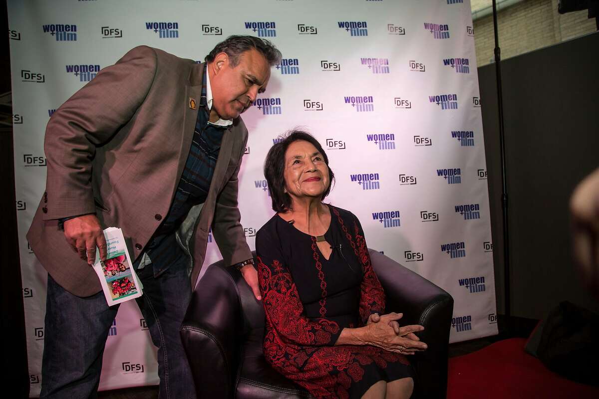 Dolores Huerta, 87, the co-founder of United Farm Workers, visits Denver, CO for an April 4, 2017 Women+Film Festival screening of a new documentary showcasing her life and activism. Huerta's son, Emilio Huerta, helps his mother before an interview by student filmmakers at the screening of the documentary.