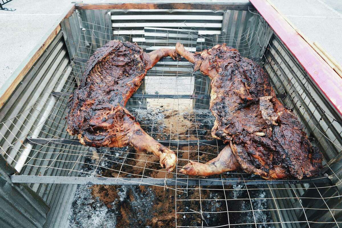 Feges BBQ put whole hogs on the pit at the 2015 Houston Barbecue Festival. Robert J. Lerma