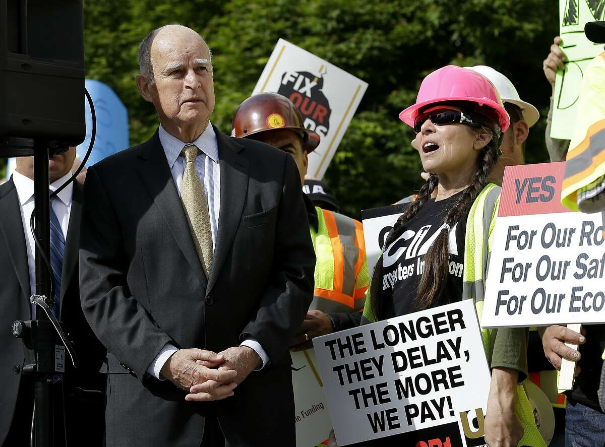 California Gov. Jerry Brown waits to speak a rally to urge lawmakers to approve a plan for a $5 billion-a-year tax and fee road repair measure during a rally Wednesday, April 5, 2017, in Sacramento, Calif. The bill, SB1, supported by Brown and Democratic Legislative leaders, is expected to be voted on by the California Legislature on Thursday. (AP Photo/Rich Pedroncelli)