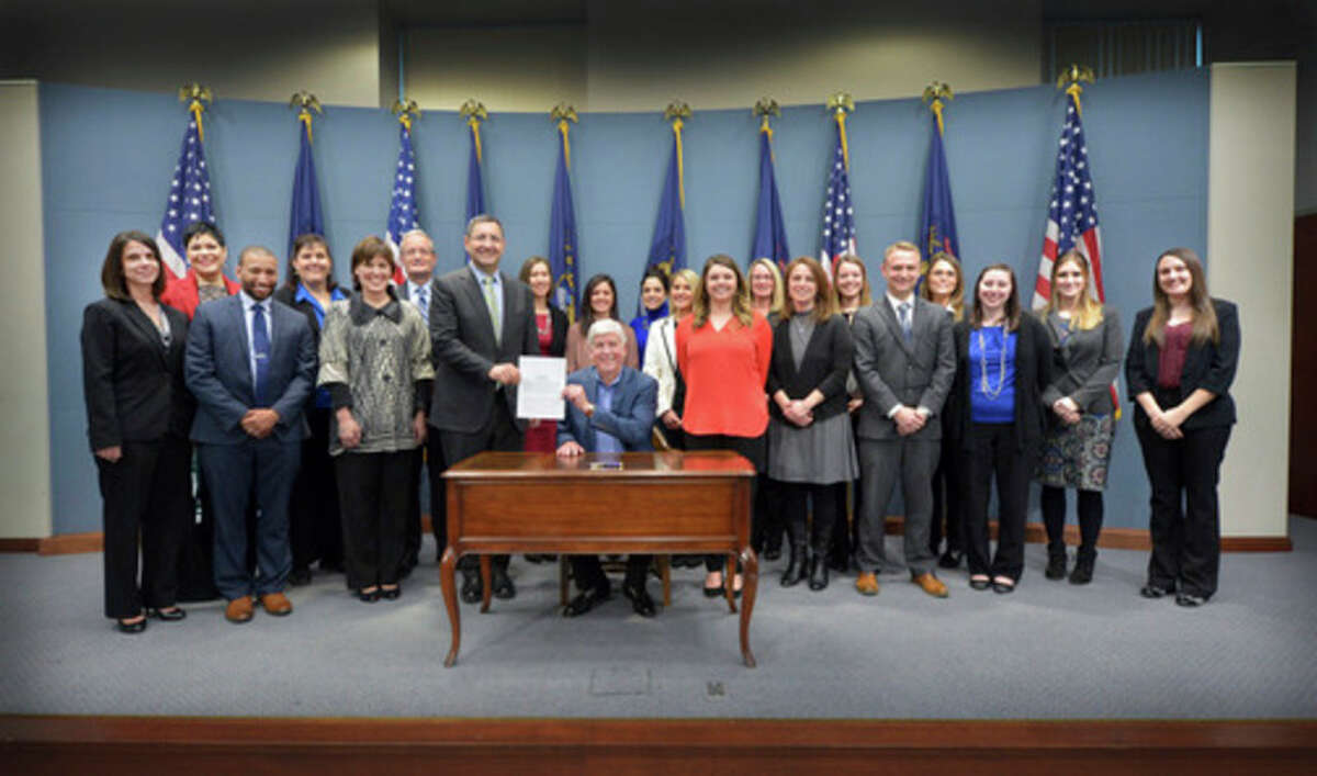 Sen. Jim Stamas, R-Midland, joined children's advocacy center board members from across the state as Gov. Rick Snyder signed Stamas' legislation to help the centers protect Michigan children. Public Act 491 of 2016 will enable children's advocacy centers to access abuse and neglect information that can be critical in supporting young victims.