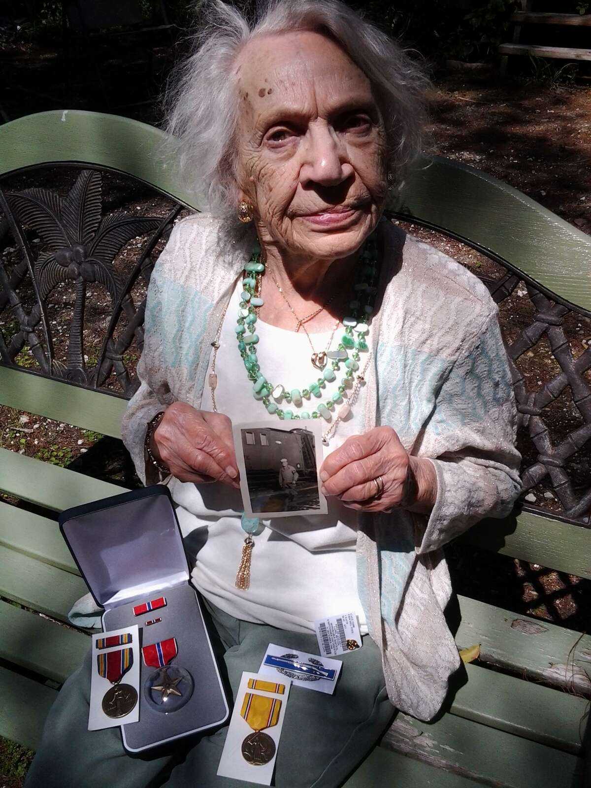Helen Shimeski displays the medals her husband was awarded in World War II.