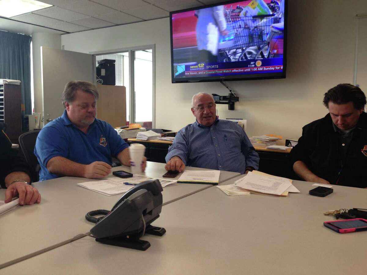Stamford Director of Operations Ernie Orgera (center) updates city staff on preparations for the upcoming snow storm.