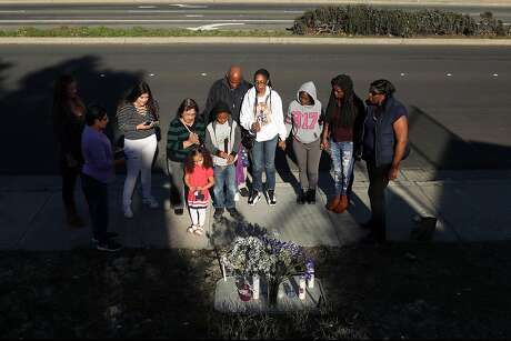 On Saturday, December 3, 2016, the one year anniversary of the shooting death of her daughter Ronique Gardner-Williams, Nicole Gardner-Lewis, her husband, Maurice, and children, Nicholas, 8, and Amauriana, 2, and others hold a candlelight vigil at the site of Ronique's murder along Hilltop Drive in Richmond, Calif..