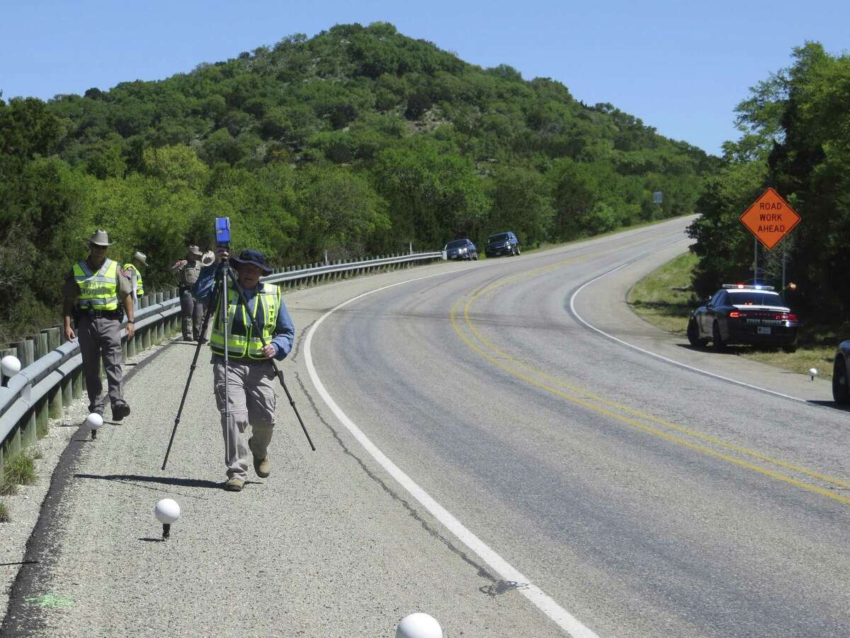 National Transportation Safety Board investigator Bob Squire sets up a 3-D laser scanner to digitally map the site on U.S. 83 in Uvalde County of a March 29, 2017 collision that killed 13 seniors from the First Baptist Church of New Braunfels.