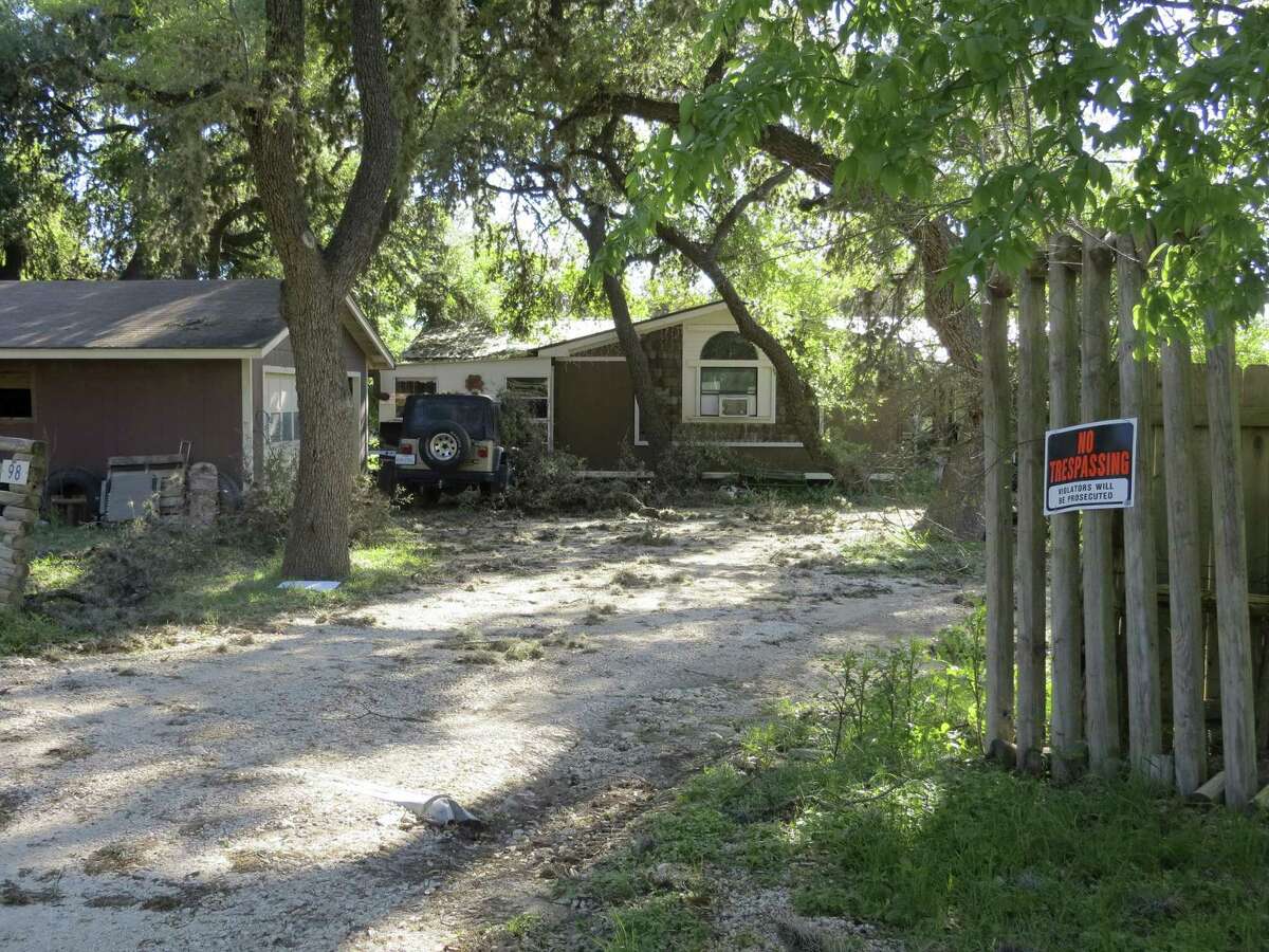 A no trespassing sign has been posted outside the Leakey area home of Jack D. Young since his involvement in a March 29, 2017 head-on collision on U.S. 83 that killed 13 members of a New Braunfels Church. He was released Tuesday from the hospital where he was treated for crash injuries. A woman who came and left the home Wednesday said, "We have no comment. Please leave us alone." A recent storm left broken tree limbs on the property, as well as hundreds of ball moss.