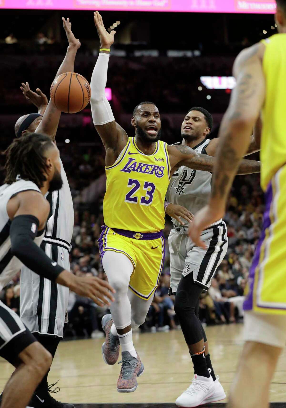 Los Angeles Lakers forward LeBron James (23) is fouled as he drives to the basket against the San Antonio Spurs during the first half of an NBA basketball game, Saturday, Oct. 27, 2018, in San Antonio. (AP Photo/Eric Gay)