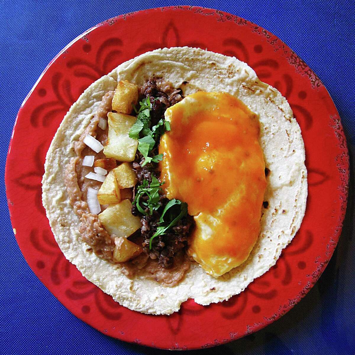 Huevos rancheros taco with barbacoa on a handmade corn tortilla from Taqueria Lupita on U.S. 181 South.