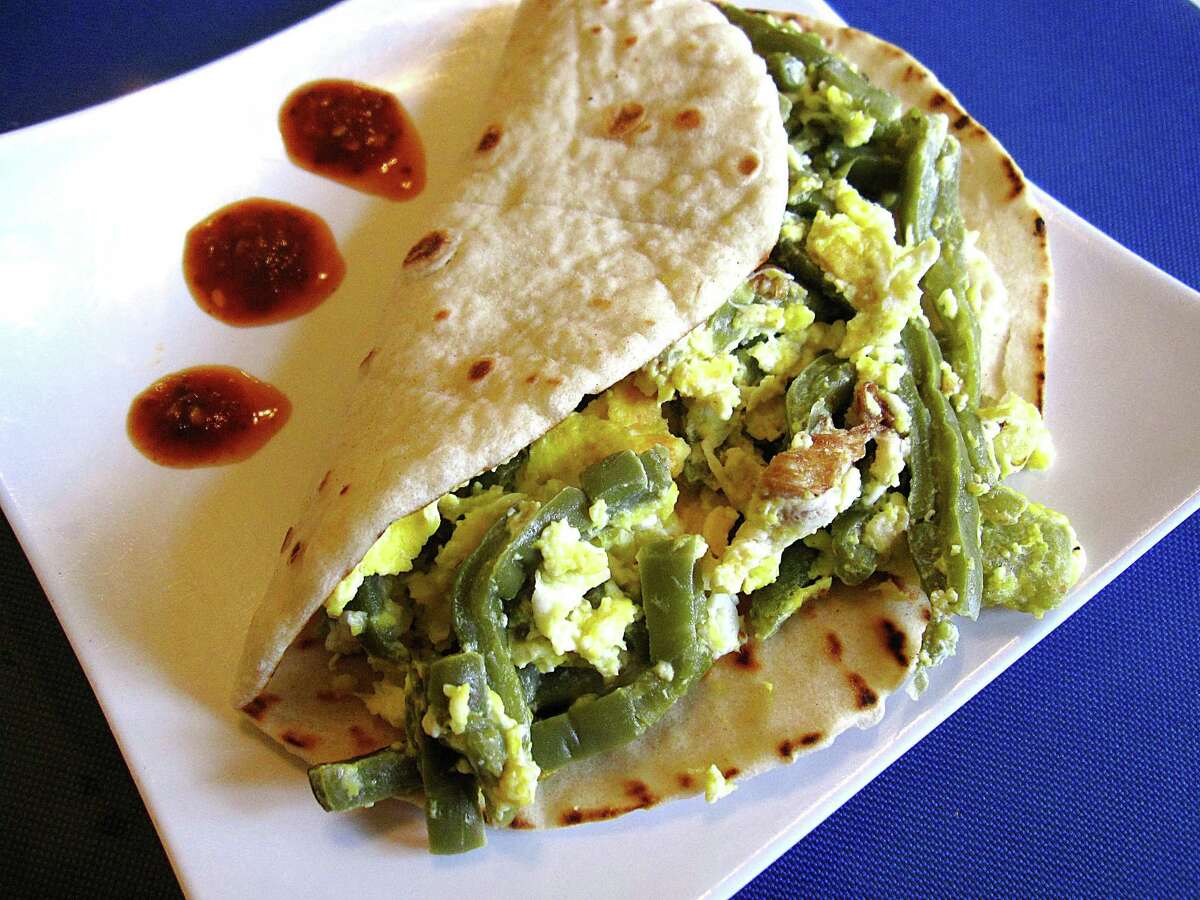 Nopales and egg taco on a handmade flour tortilla from Taqueria Lupita.