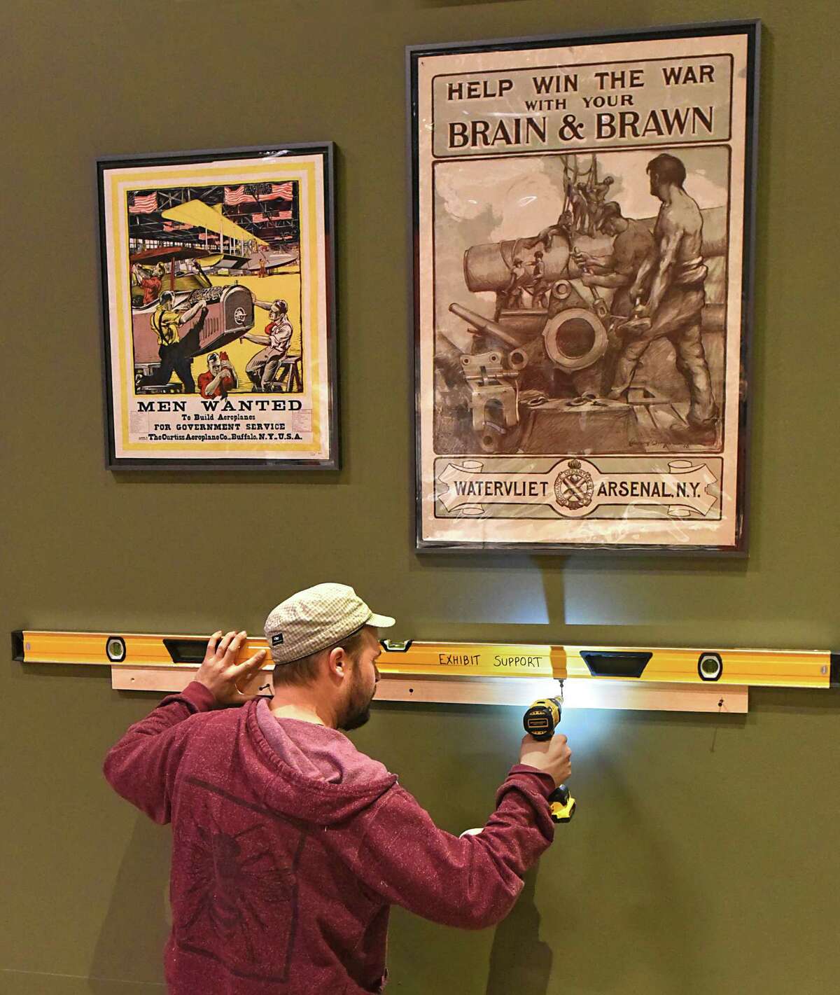 Museum and Exhibit Specialist Ethan Hacklin sets up an exhibit at the State Museum in Albany, N.Y., on Thursday, March 30, 2017, commemorating the 100 years since the US entered World War I. (Lori Van Buren / Times Union)