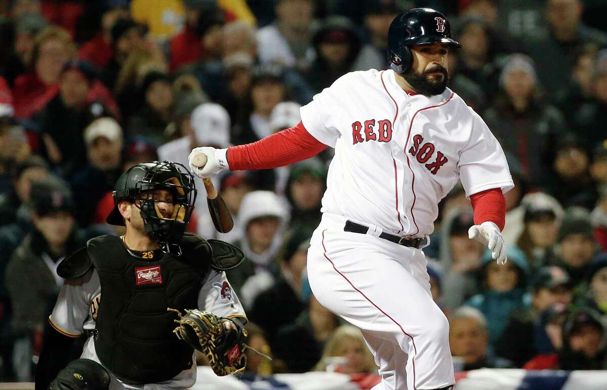 Boston Red Sox's Sandy Leon follows through on a double in front of Pittsburgh Pirates' Francisco Cervelli during the third inning of a baseball game in Boston, Wednesday, April 5, 2017. (AP Photo/Michael Dwyer) ORG XMIT: MAMD105