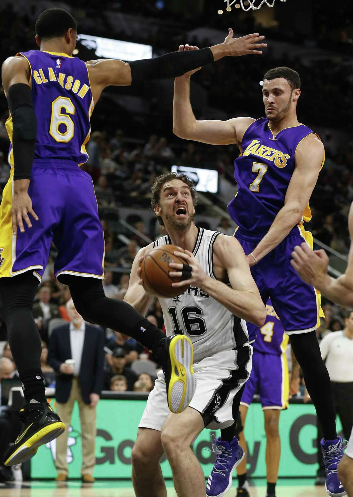 Spurs' Pau Gasol (16) attempts a score under the basket against Los Angeles Lakers' Jordan Clarkson (06) and Larry Nance, Jr. (07) during their game at the AT&T Center on Wednesday, Apr. 5, 2017. (Kin Man Hui/San Antonio Express-News)