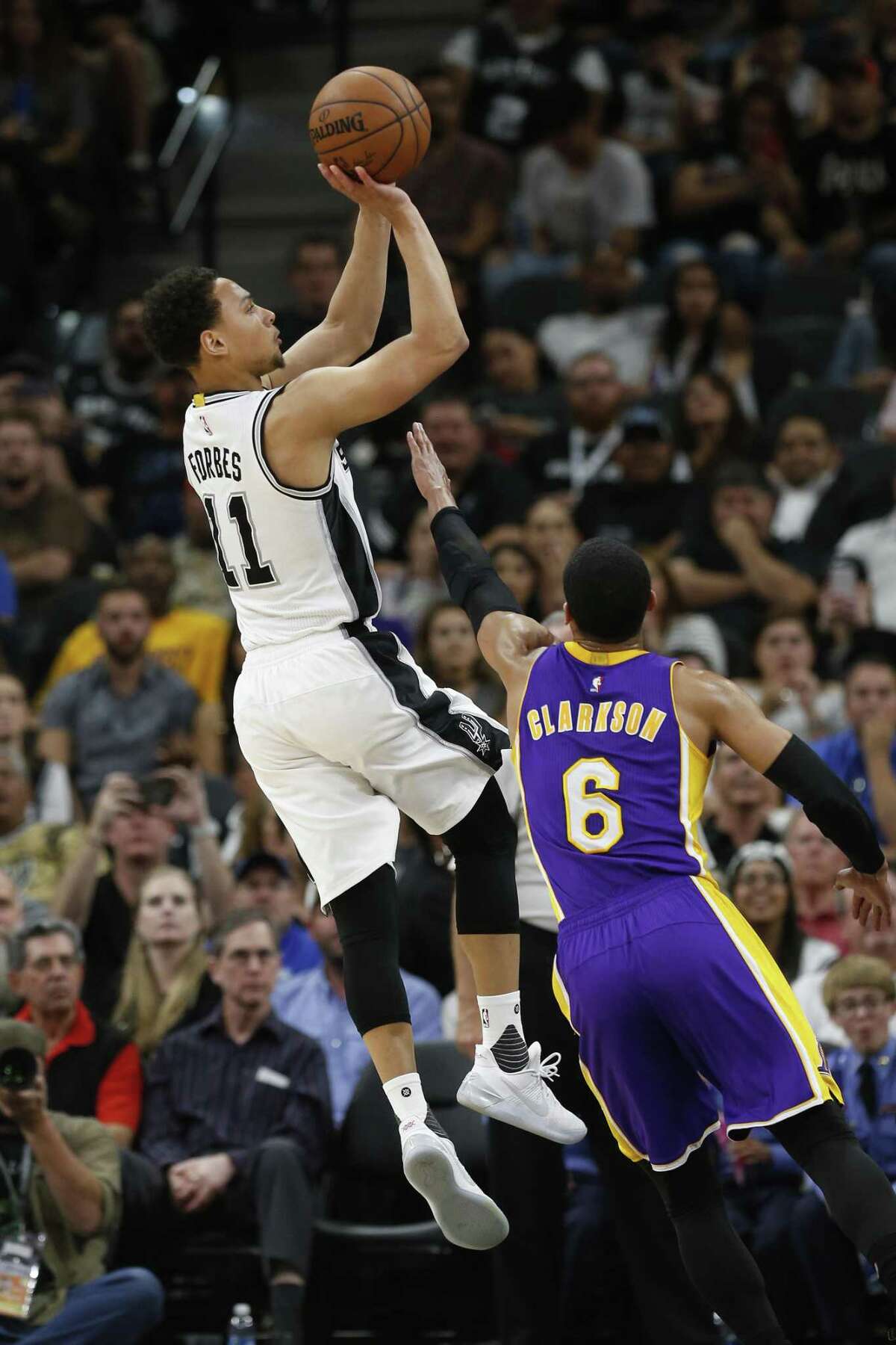Spurs’ Bryn Forbes shoots against the Los Angeles Lakers’ Jordan Clarkson (6) during their game at the AT&T Center on April 5, 2017.